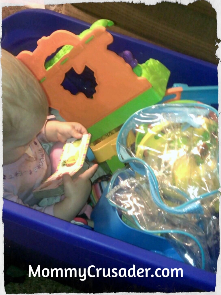 Hiding in the toy box| MommyCrusader.com